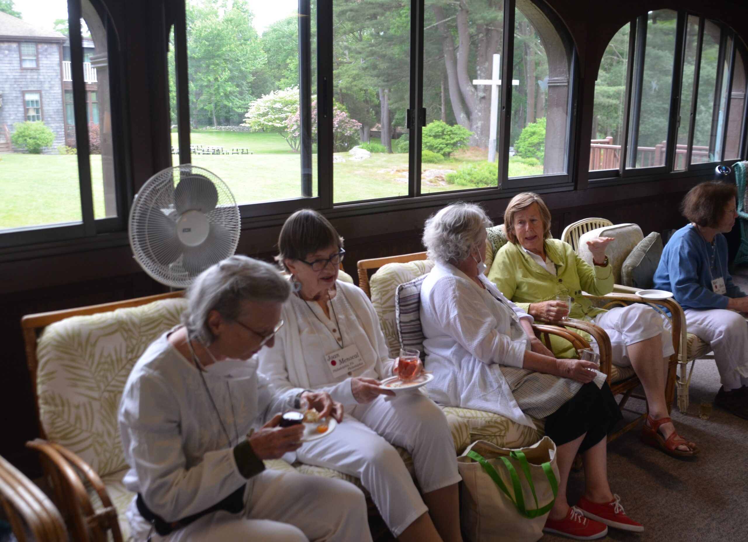 Five Companions seated in a main gathering place at Adelynrood, the San Damiano porch.